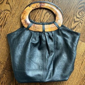 Black leather handbag with wooden handles